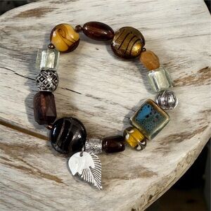 AVON 2010 Beaded Chic Bracelet Nature Brown Stretchy W/ MOP Elephant Charm